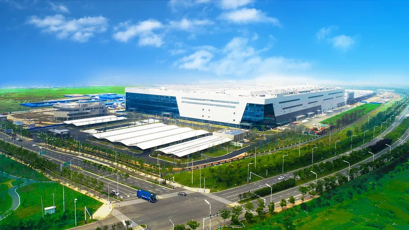 Aerial view of CXMT's semiconductor fabrication campus in Hefei, China, showing multiple large factory buildings